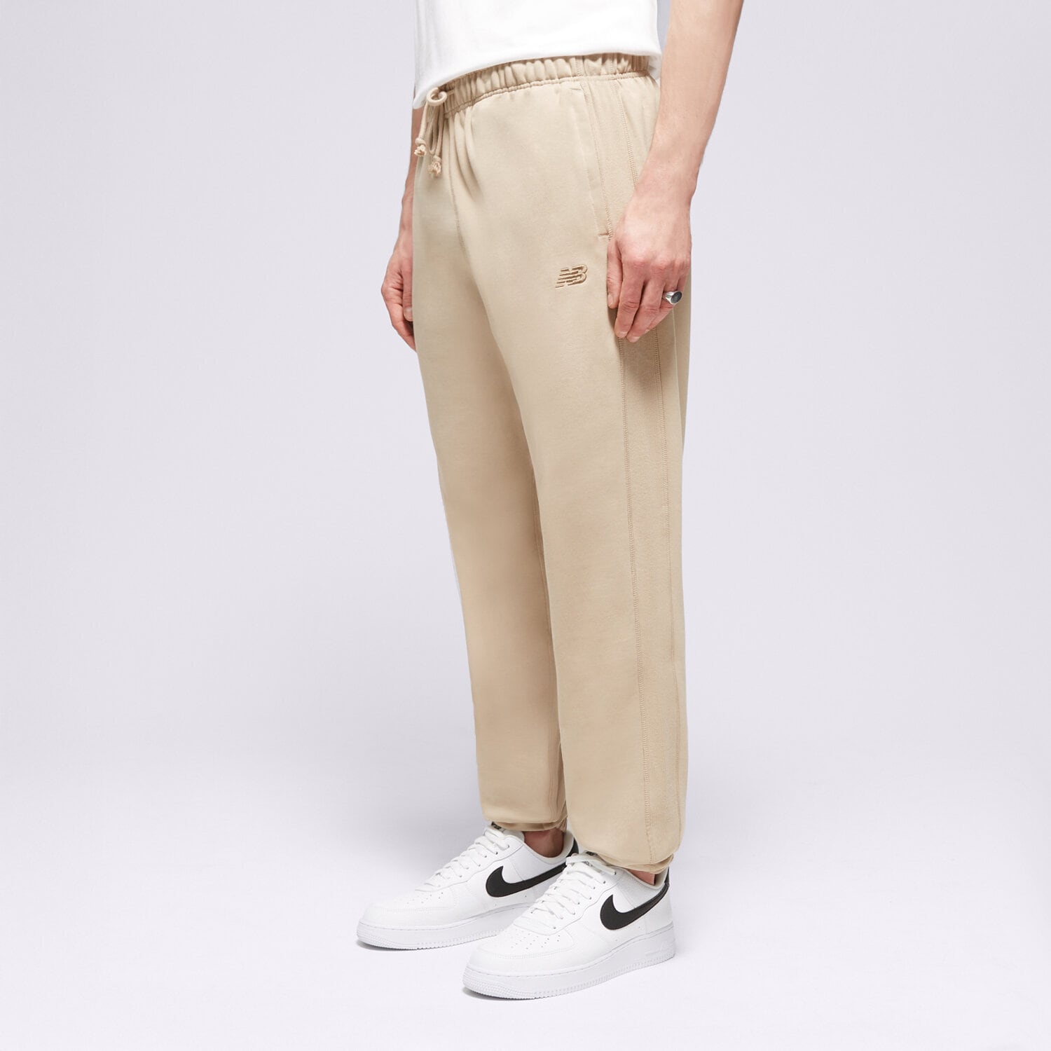 Herren Hosen NEW BALANCE HOSE ATHLETICS FRENCH TERRY JOGGER MP41508SOT Beige