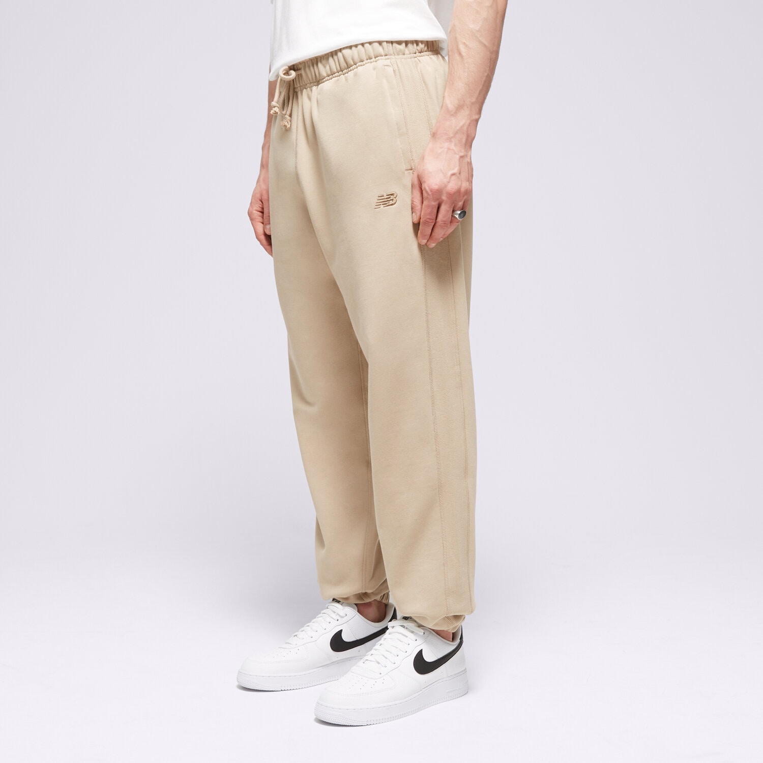 Herren Hosen NEW BALANCE HOSE ATHLETICS FRENCH TERRY JOGGER MP41508SOT Beige