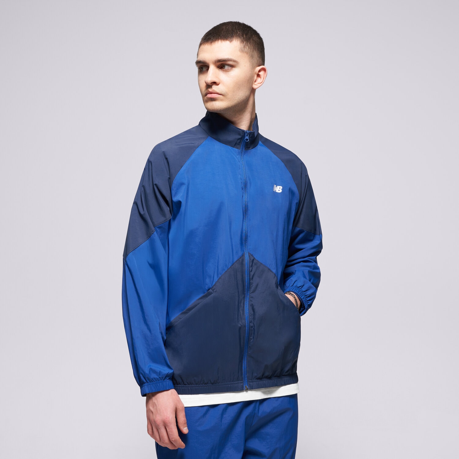 Herren Übergangsjacke NEW BALANCE JACKE ORTALION SPORT LEGACY JACKET MJ61J73YNNY Dunkelblau