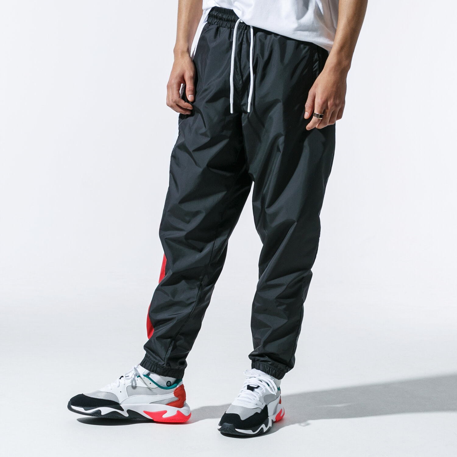 Herren Hosen NEW ERA HOSE COLOUR TRACK PANT BLKRED NEW ERA BLKWHIFDR 12123956 Schwarz
