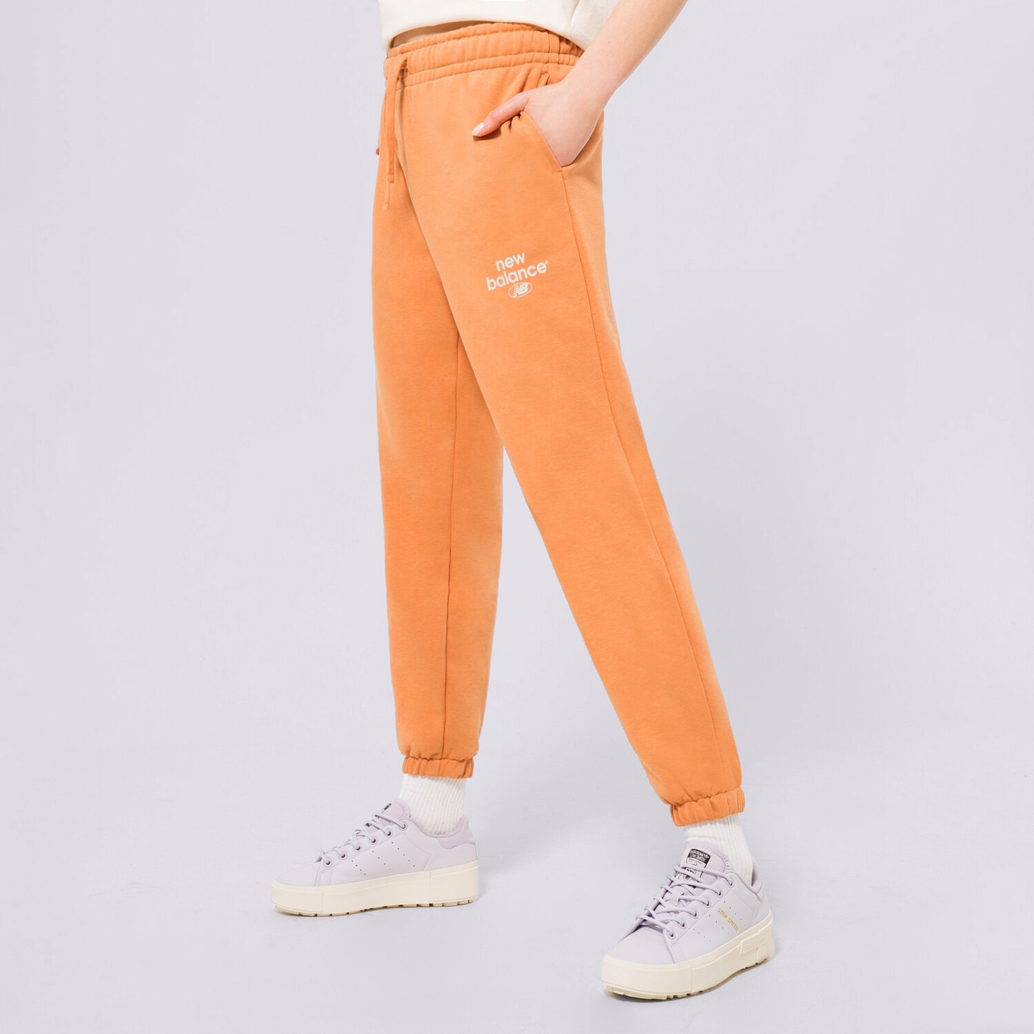 Damen Hosen NEW BALANCE HOSE NB ESSENTIALS GRAPHIC FLEECE WP31508SEI Orange
